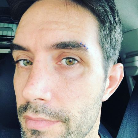 Casey Manderson is taking selfie on his car.